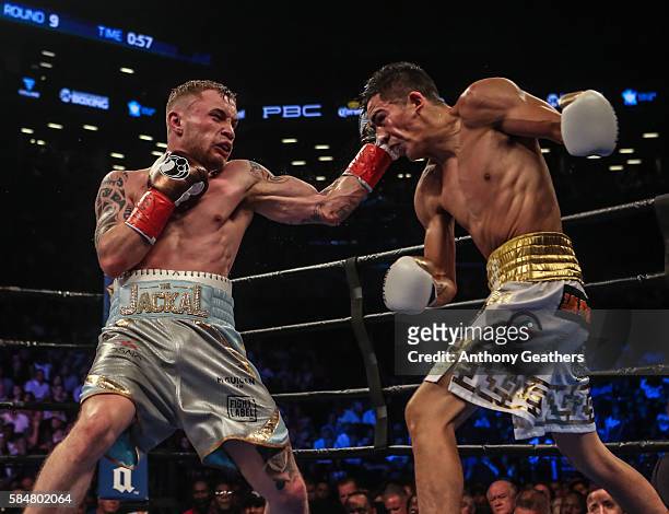 Leo Santa Cruz of Mexico fights Carl Frampton of Northern Ireland during their 12 round WBA Super featherweight championship bout at Barclays Center...
