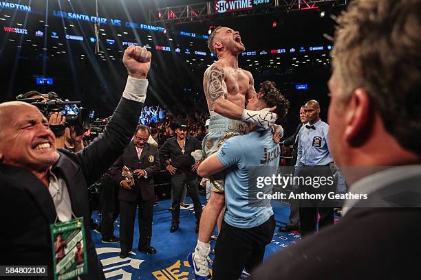 Carl Frampton celebrates his win after defeating Leo Santa Cruz in the 12 round WBA Super featherweight championship bout at Barclays Center on July...