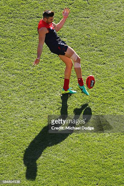 Chris Dawes of the Demons kicks the ball during the round 19 AFL match between the Melbourne Demons and the Gold Coast Suns at Melbourne Cricket...