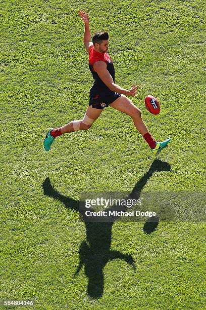 Chris Dawes of the Demons kicks the ball during the round 19 AFL match between the Melbourne Demons and the Gold Coast Suns at Melbourne Cricket...