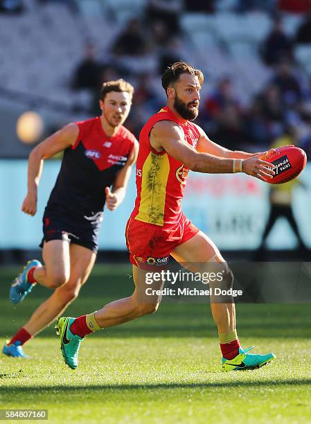 Nick Malceski of the Suns looks upfield during the round 19 AFL match between the Melbourne Demons and the Gold Coast Suns at Melbourne Cricket...