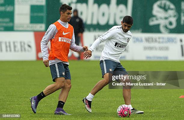 Ever Banega is challenged by Pires Ribeiro Dodo during of the FC Internazionale Juvenile Team training Session on July 31, 2016 in Bruneck,