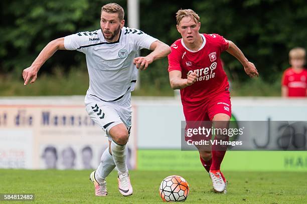 Nejc Skubic of Konyaspor, Fredrik Jensen of FC Twente during the friendly match between FC Twente and Konyaspor at Stadion am Heideweg on july 31,...