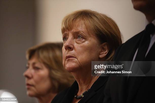 German chancellor Angela Merkel attends a memorial service for the victims of last week's shooting spree that left nine victims dead on July 31, 2016...