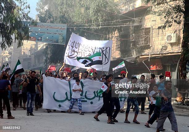 Civilians stage a protest against Assad Regime in Al Mashhad neighborhood, where sieged by Assad Regime forces in Aleppo, Syria on July 31, 2016.