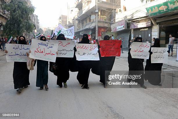 Civilians stage a protest against Assad Regime in Al Mashhad neighborhood, where sieged by Assad Regime forces in Aleppo, Syria on July 31, 2016.