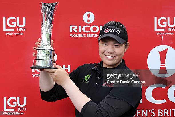Ariya Jutanugarn of Thailand poses with the trophy following her victory during the final round of the Ricoh Women's British Open at Woburn Golf Club...