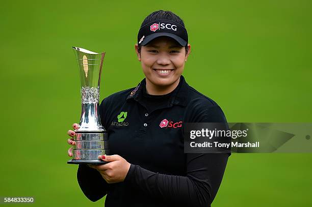 Ariya Jutanugarn of Thailand poses with the trophy following her victory during the final round of the Ricoh Women's British Open at Woburn Golf Club...