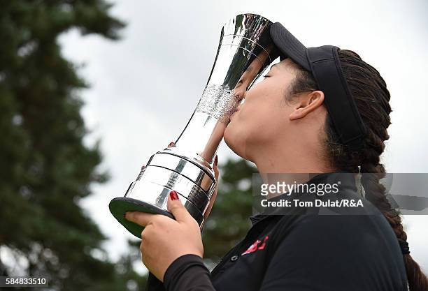 Ariya Jutanugarn of Thailand kisses the trophy following her victory during the final round of the Ricoh Women's British Open at Woburn Golf Club on...