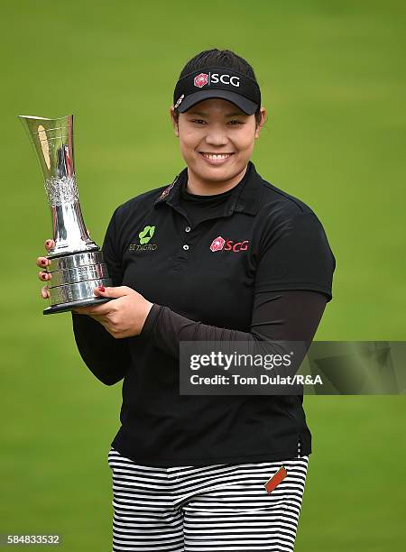 Ariya Jutanugarn of Thailand poses with the trophy following her victory during the final round of the Ricoh Women's British Open at Woburn Golf Club...