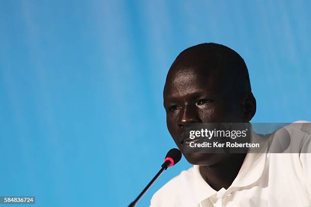 James Chiengjiek of the Olympic Refugee Team talks while attending a press conference given by the Olympic Refugee Team on July 31, 2016 in Rio de...