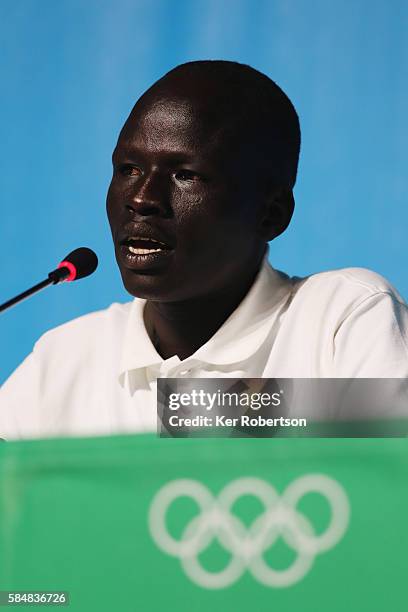 James Chiengjiek of the Olympic Refugee Team talks while attending a press conference given by the Olympic Refugee Team on July 31, 2016 in Rio de...