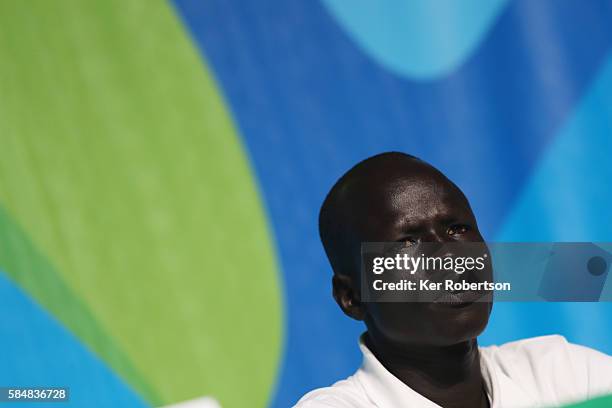 James Chiengjiek of the Olympic Refugee Team talks while attending a press conference given by the Olympic Refugee Team on July 31, 2016 in Rio de...