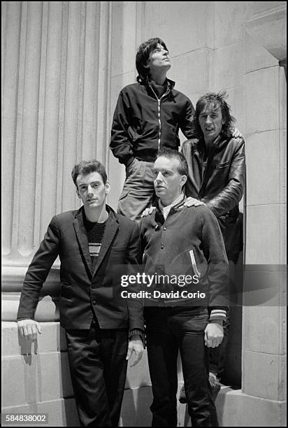 Group portrait of Ruts DC on Kilburn High Road, London, 1981.