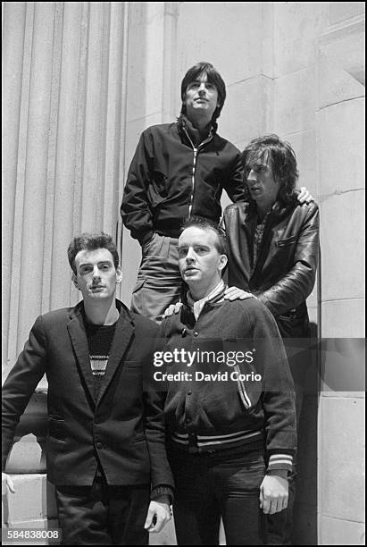 Group portrait of Ruts DC on Kilburn High Road, London, 1981.