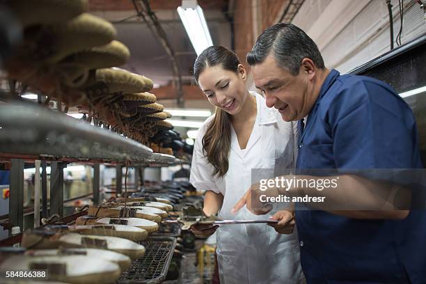 workers at a shoe-making factory - shoe factory stock pictures, royalty-free photos & images