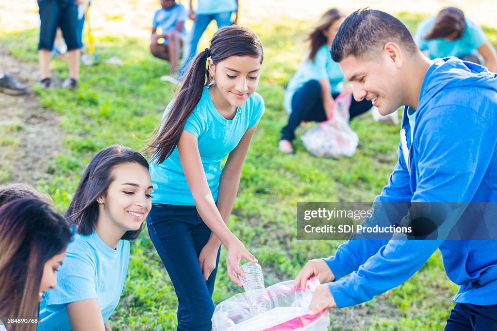 Family helps neighbors clean up park