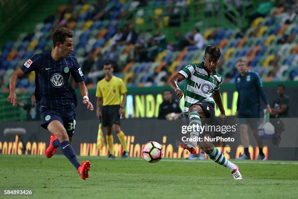 Sporting's forward Matheus Pereira vies with Wolfsburg's forward Ismail Azzaoui during the Trofeu Cinco Violinos football match Sporting CP vs...