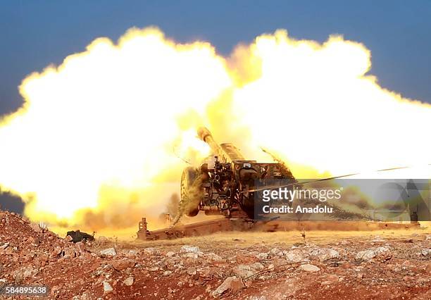 An artillery, belongs to anti-regimist opposition forces group named Jaish al-Fath, is being fired to hit an Assad Regime's base located in Rashideen...