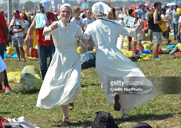 Nuns celebrate the end of the World Youth Day as Pope Francis finishes the Mass in Brzegi, near Krakow. On Sunday, 31 July 2016, in Brzegi, Krakow,...