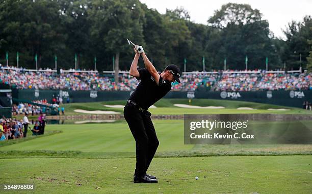 Jimmy Walker of the United States plays his shot from the fourth tee during the final round of the 2016 PGA Championship at Baltusrol Golf Club on...