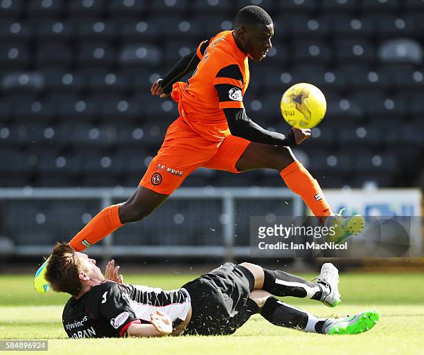 Lewis Martin of Dunfermline Athletic vies with Tope Obadeyi of Dundee United during the Betfred League Cup group match between Dundee United and...