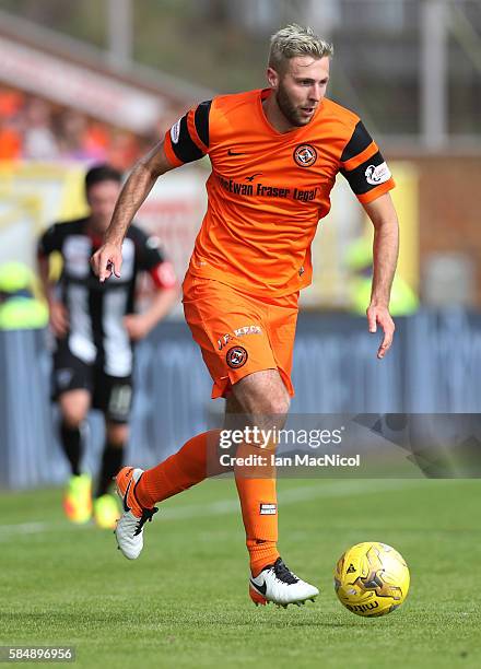 Lewis Toshney of Dundee United controls the ball during the Betfred League Cup group match between Dundee United and Dunfermline Athletic at...