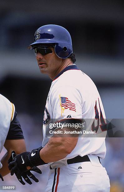 Jose Canseco of the Chicago White Sox looks on before going to bat during the game against the Pittsburgh Pirates at Comiskey Park in Chicago,...