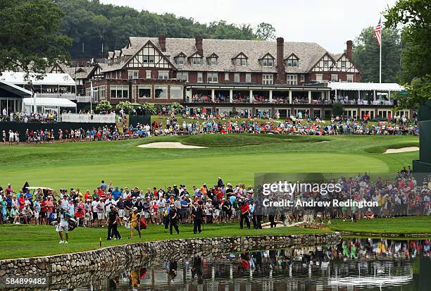 Jason Day of Australia and Emiliano Grillo of Argentina walk on the fourth hole during the final round of the 2016 PGA Championship at Baltusrol Golf...