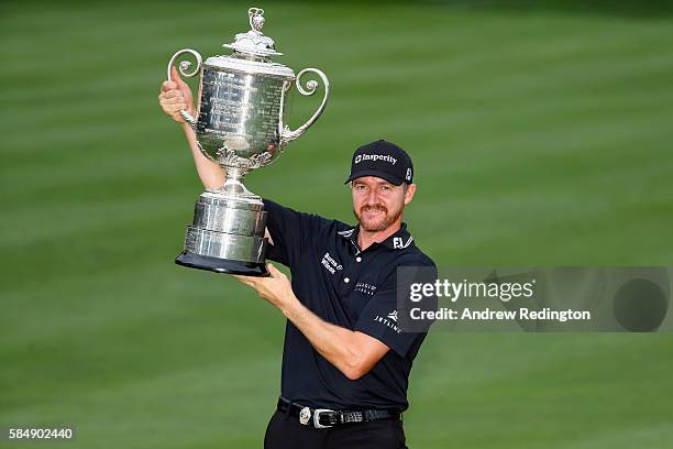 Jimmy Walker of the United States celebrates with the Wanamaker Trophy after winning the 2016 PGA Championship at Baltusrol Golf Club on July 31,...