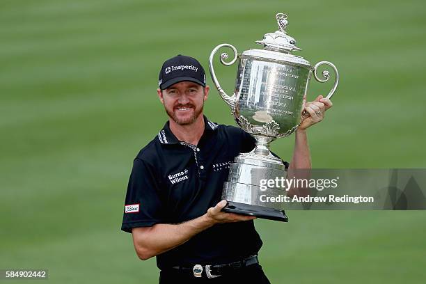 Jimmy Walker of the United States celebrates with the Wanamaker Trophy after winning the 2016 PGA Championship at Baltusrol Golf Club on July 31,...