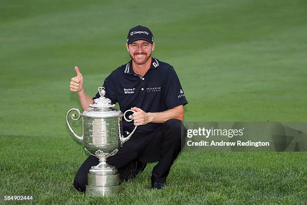 Jimmy Walker of the United States celebrates with the Wanamaker Trophy after winning the 2016 PGA Championship at Baltusrol Golf Club on July 31,...