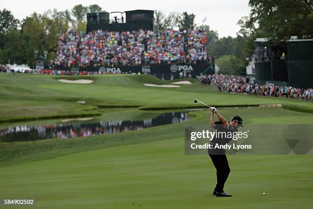 Jimmy Walker of the United States hits his second shot on the 18th hole during the final round of the 2016 PGA Championship at Baltusrol Golf Club on...