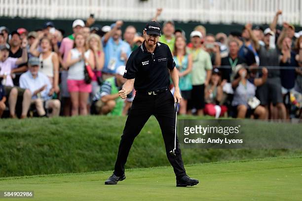 Jimmy Walker of the United States celebrates a putt for eagle on the 17th hole during the final round of the 2016 PGA Championship at Baltusrol Golf...