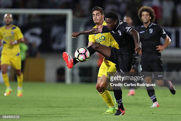 Guimaraes's forward Francis vies with Porto's midfielder Ruben Neves during the match between Vitoria Guimaraes v Porto match for the Guimaraes City...
