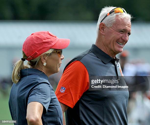 Owners Jimmy and Dee Haslam of the Cleveland Browns walks onto the field during training camp on July 31, 2016 at the Cleveland Browns training...
