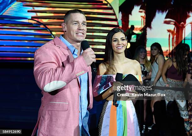 Co-hosts John Cena and Victoria Justice speak onstage during Teen Choice Awards 2016 at The Forum on July 31, 2016 in Inglewood, California.
