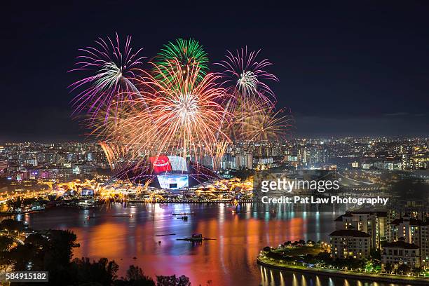 fireworks at singapore sports hub - national holiday stock pictures, royalty-free photos & images