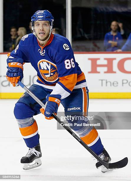 Nikolay Kulemin of the New York Islanders plays in the game against the Calgary Flames at Barclays Center on October 26, 2015 in Brooklyn borough of...