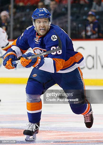 Nikolay Kulemin of the New York Islanders plays in the game against the Calgary Flames at Barclays Center on October 26, 2015 in Brooklyn borough of...