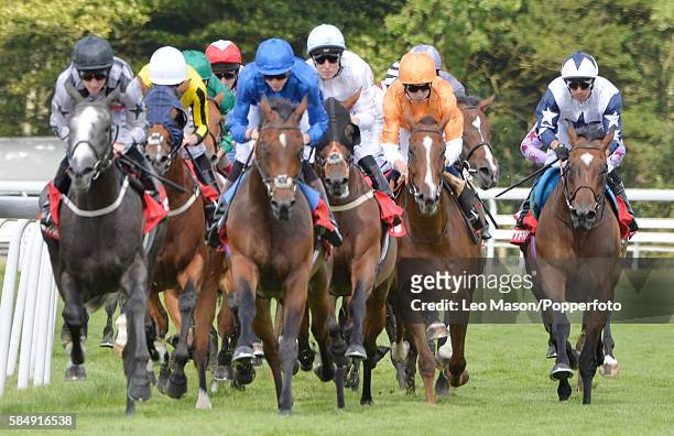 The Betfred Mile field on the top bend during Qatar Goodwood Festival 2016 at Goodwood on July 29, 2016 in Chichester, England.