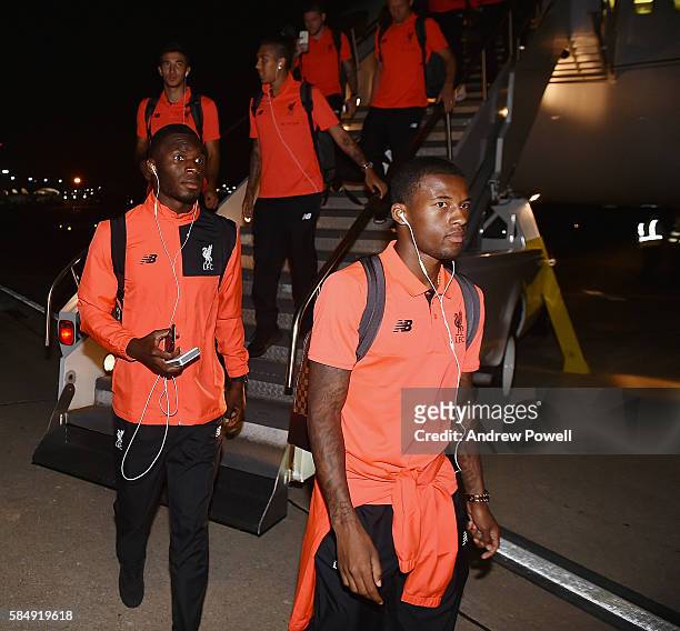 Christian Benteke and Georginio Wijnaldum of Liverpool disembark the plane for their final leg of the American Pre Season tour on July 31, 2016 in St...