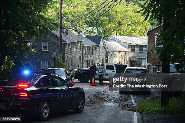 Police close streets into Elliott City after massive destruction was caused by a flash flood in Ellicott City, MD, July 31, 2016.