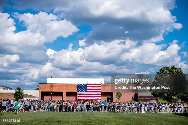 On the third day of a bus tour through Pennsylvania and Ohio, large crowd on a hot summer day listens to Democratic Nominee for President of the...