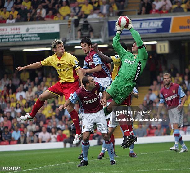 Aston Villa goalkeeper Thomas Sorenson collects the ball under pressure from Darius Henderson of Watford during the Barclays Premiership match...