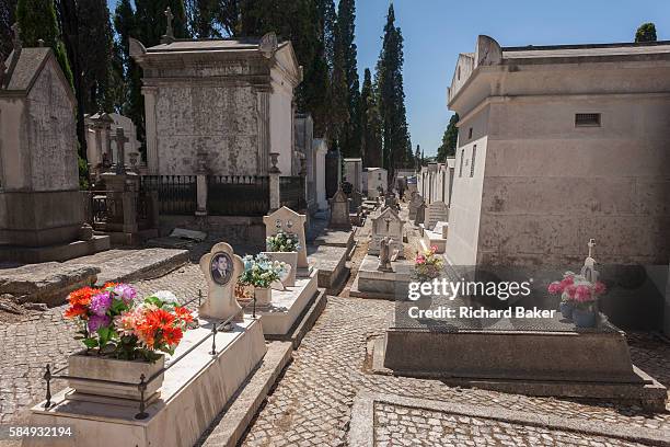 Individual tombs and family mausoleums, on 14th July 2016, at Prazeres Cemetery, Lisbon, Portugal. Prazeres Cemetery is the largest cemetery in...