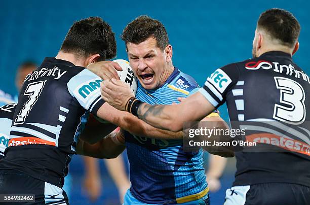 Greg Bird of the Titans in action during the round 21 NRL match between the Gold Coast Titans and the Cronulla Sharks at Cbus Super Stadium on August...