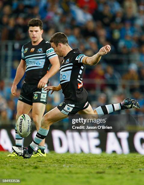 James Maloney of the Sharks attempts a field goal during the round 21 NRL match between the Gold Coast Titans and the Cronulla Sharks at Cbus Super...