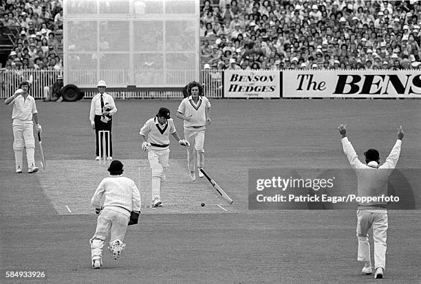 Rick McCosker of Australia is hit on the jaw by a ball from Bob Willis of England and his jaw is broken in the first innings of the Centenary Test...