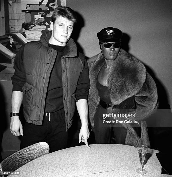 Dolph Lundgren and Grace Jones attend Dolph Lundgren on December 31, 1983 at Kamikaze Club in New York City.